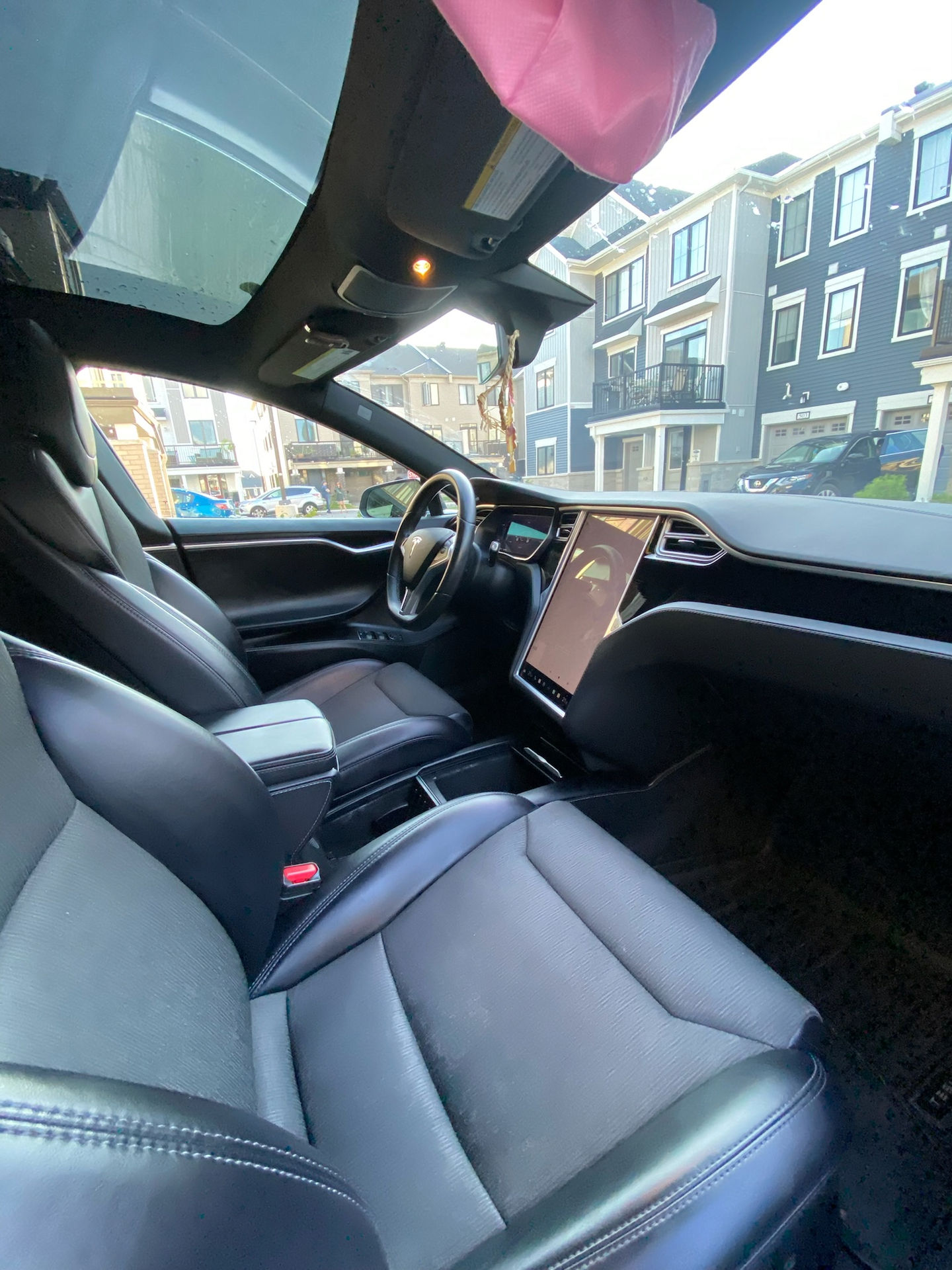 Clean Tesla interior with black leather seats